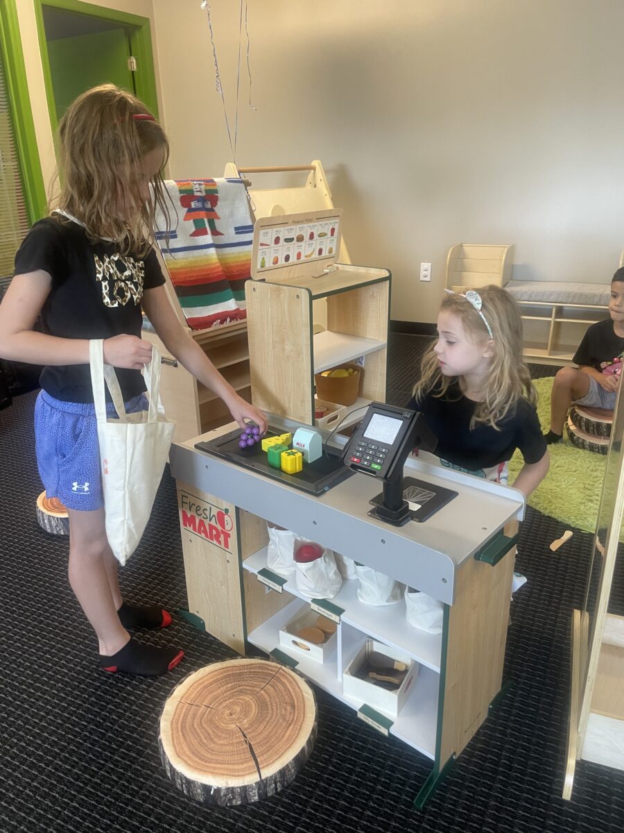 A girl is playing with a toy store